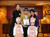 Mrs Grace Lam, Vice-chairman of the Great Chefs Working Group presents a souvenir to Mr Wong Cho-lam and Ms Leanne Li.